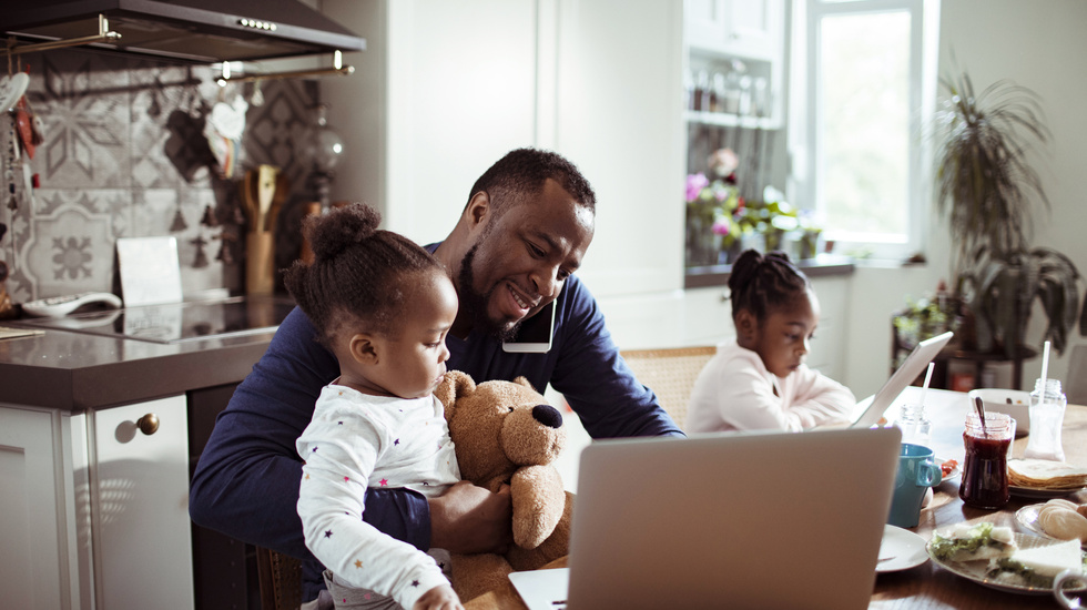 Man working from home with kids around